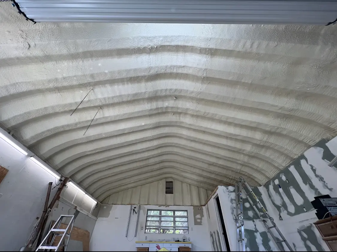 Spray polyurethane foam applied to the underside of a metal roof deck in St. Simons